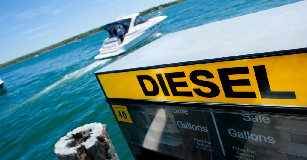 A diesel pump with a boat in the background