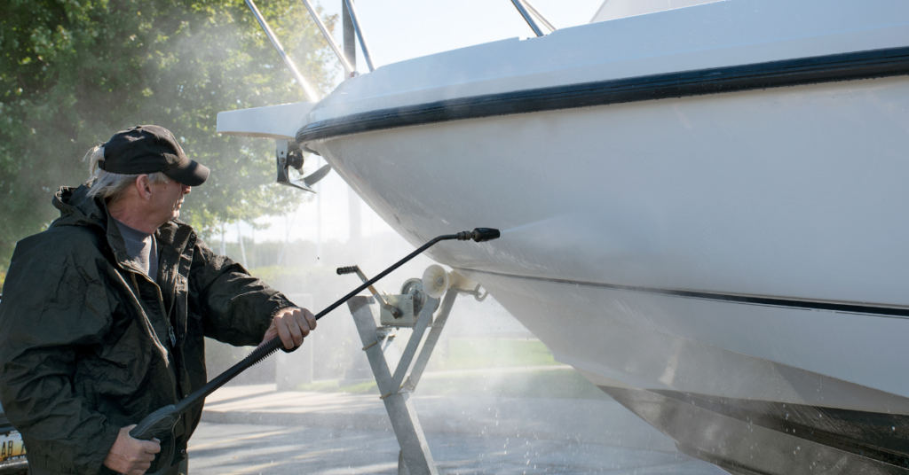 A man cleaning a boat